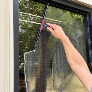 Sea Breeze A person is using a squeegee to clean a glass window, skillfully cutting through the soap suds. The fresh sea breeze wafts in, making the task of window cleaning almost pleasant. Floor And Window Cleaning